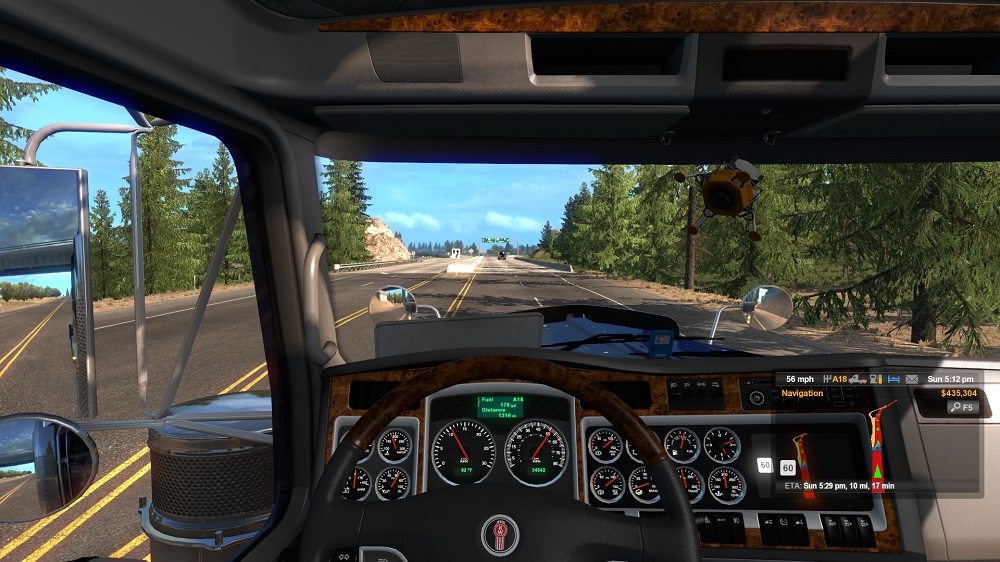 A view from inside a truck driving down a highway.